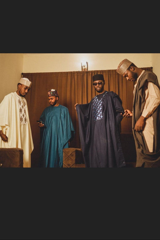 African and groomsmen wearing authentic traditional AGBADA
