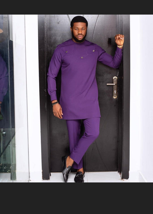 an African man wearing a stylish Caftan men's suit, purple colored and great fit.