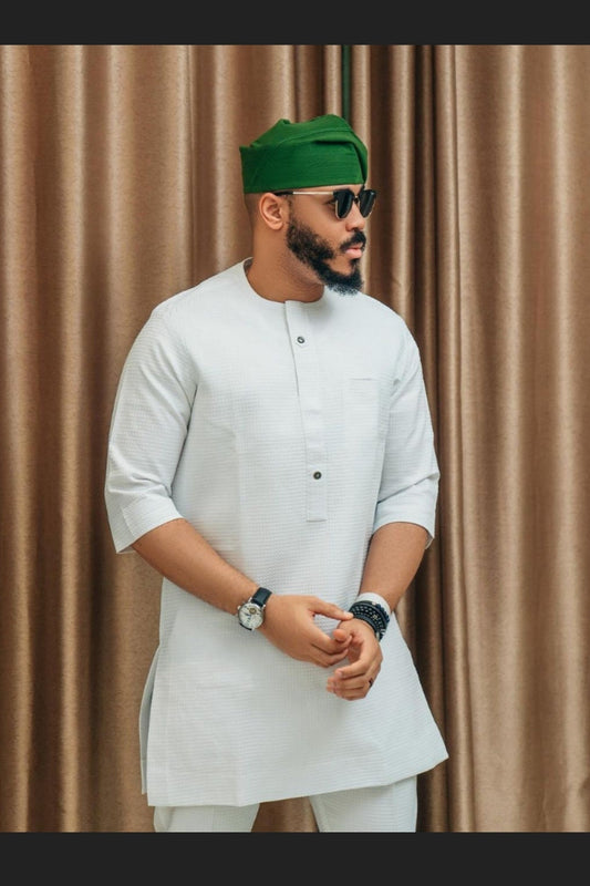 MAN IN TRENDY AFRICAN WHITE SHIRT AND PANTS